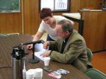 Wrangell resident Beth Comstock helps US Representative Don Young (AK-R) fill out a US Census form in the Assembly Chambers at City Hall.